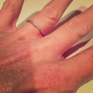 0.5 CT diamond/18 CT gold band (size 7)